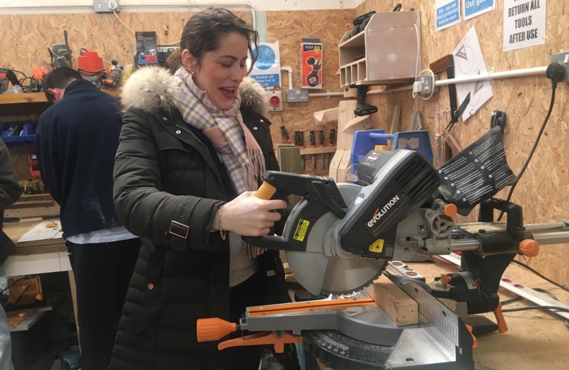 Victoria Atkins tries her hand at joinery in the Men's Shed