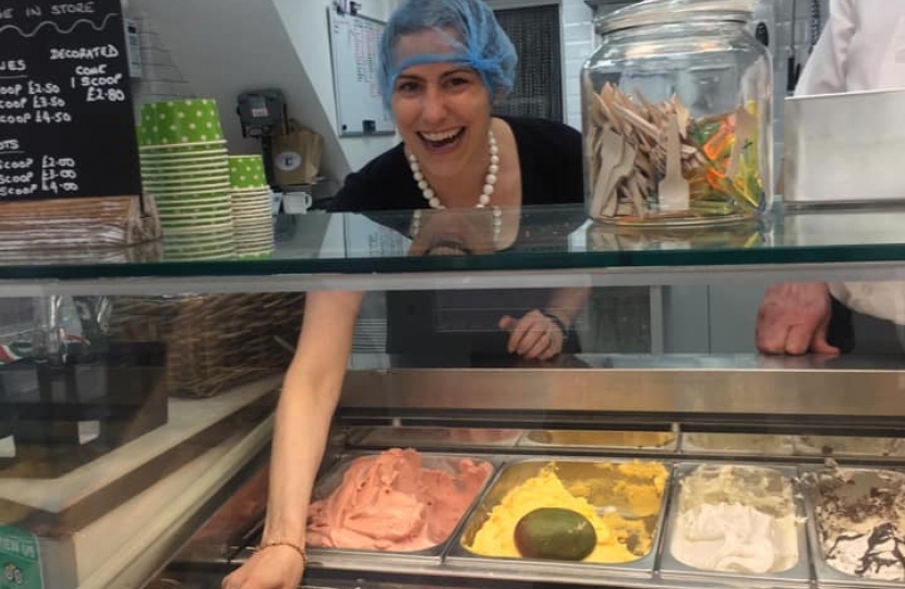 Victoria Atkins MP scoops a tub of award-winning Baci's ice cream